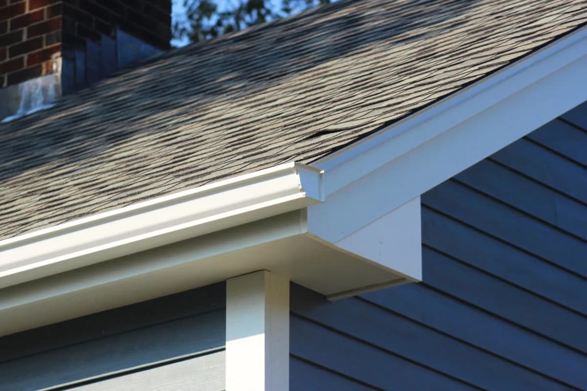 Asphalt shingle roofline and trim detail on a Back Cove home