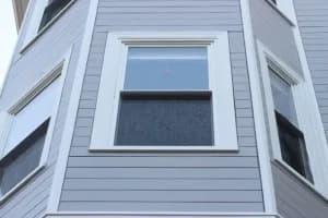 Window replacement in progress on a home near the Eastern Prom