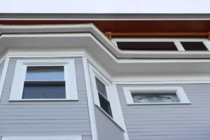Exterior trim detail around a replacement window near the Eastern Prom