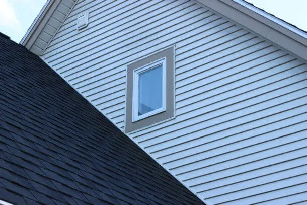 Before and after view of window replacement on a Yarmouth home